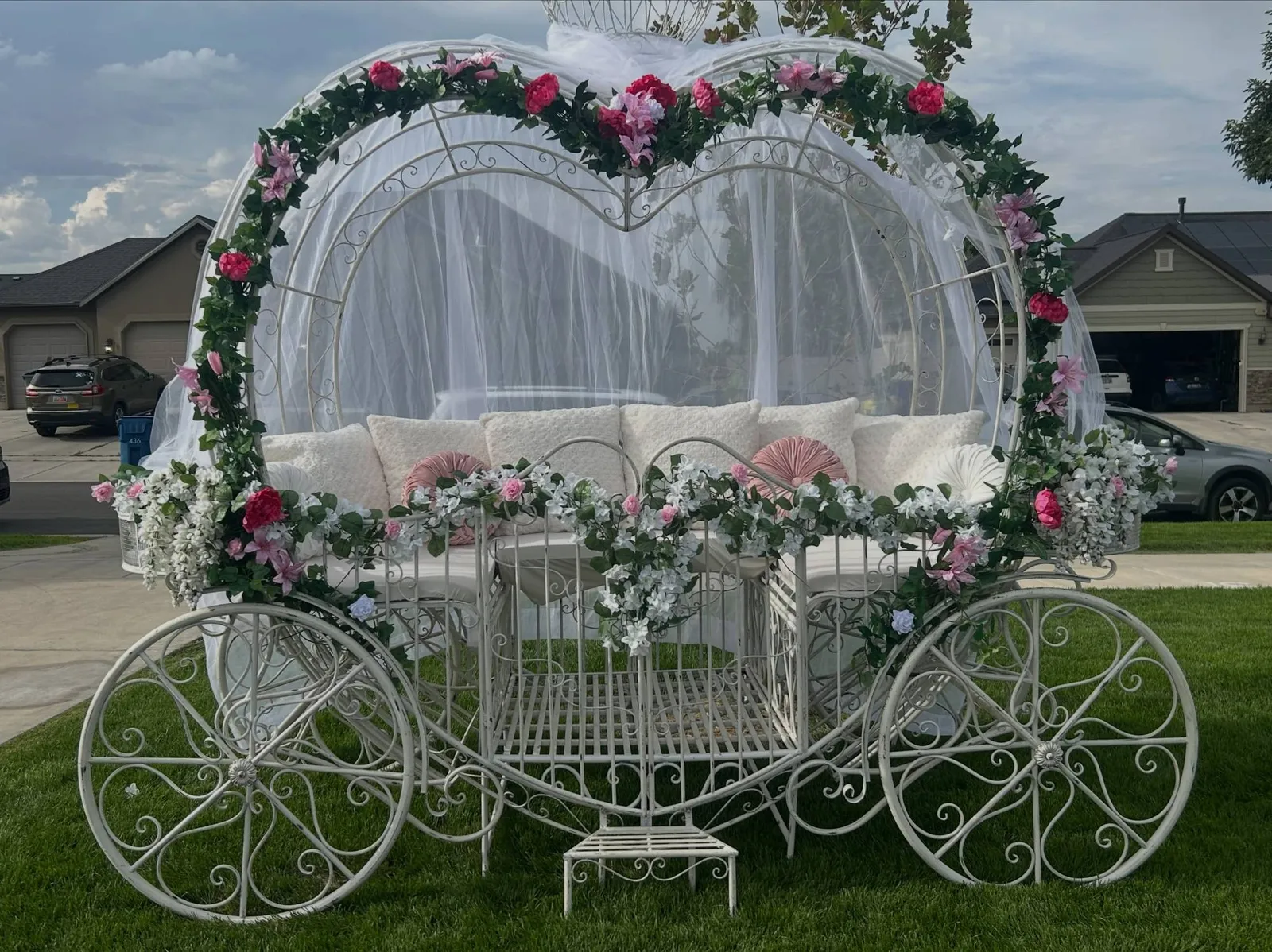 The EverGlow carriage dressed with pink and white flowers