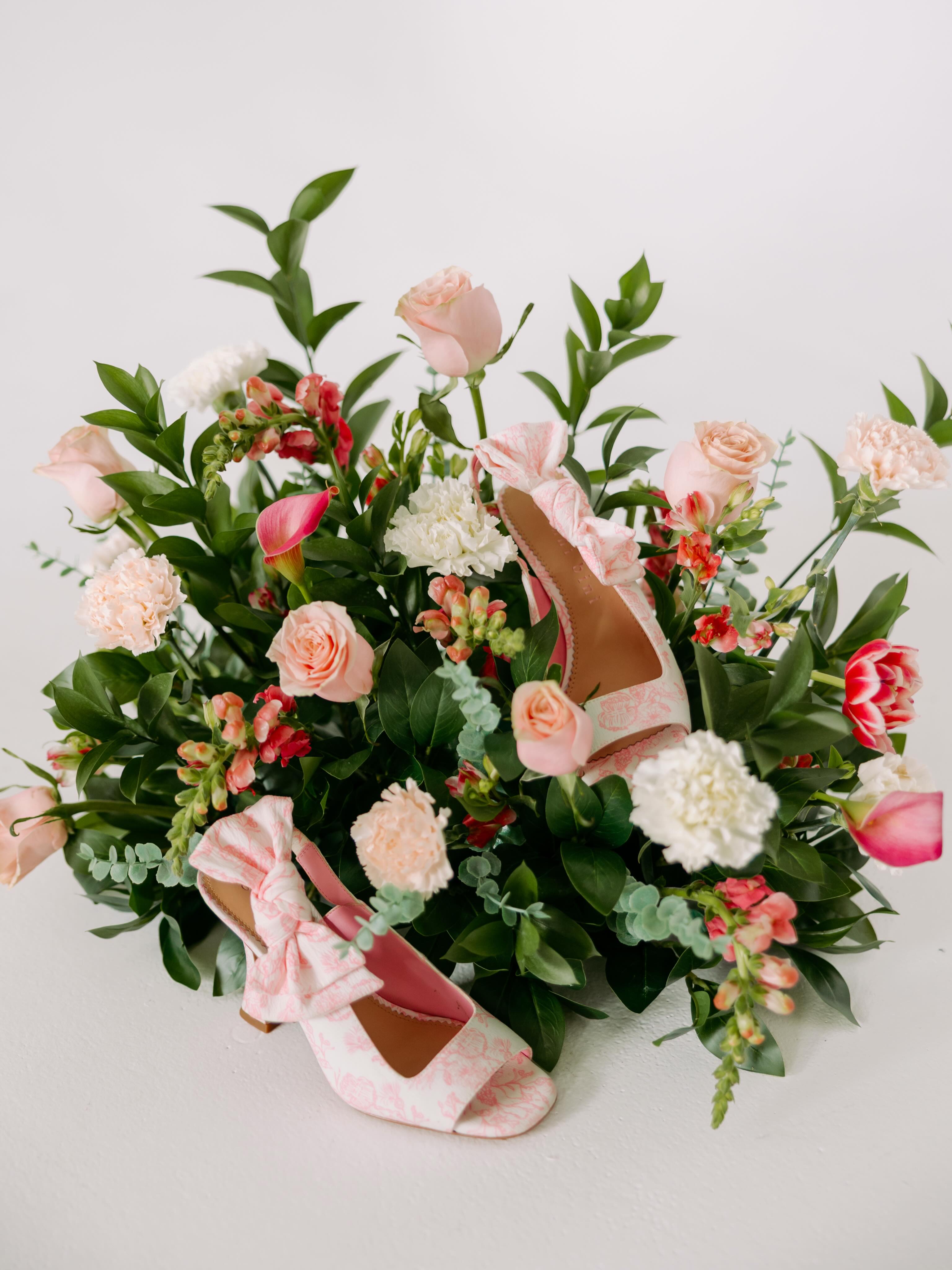 Floral styling with bridal shoes by Fernandez Florals