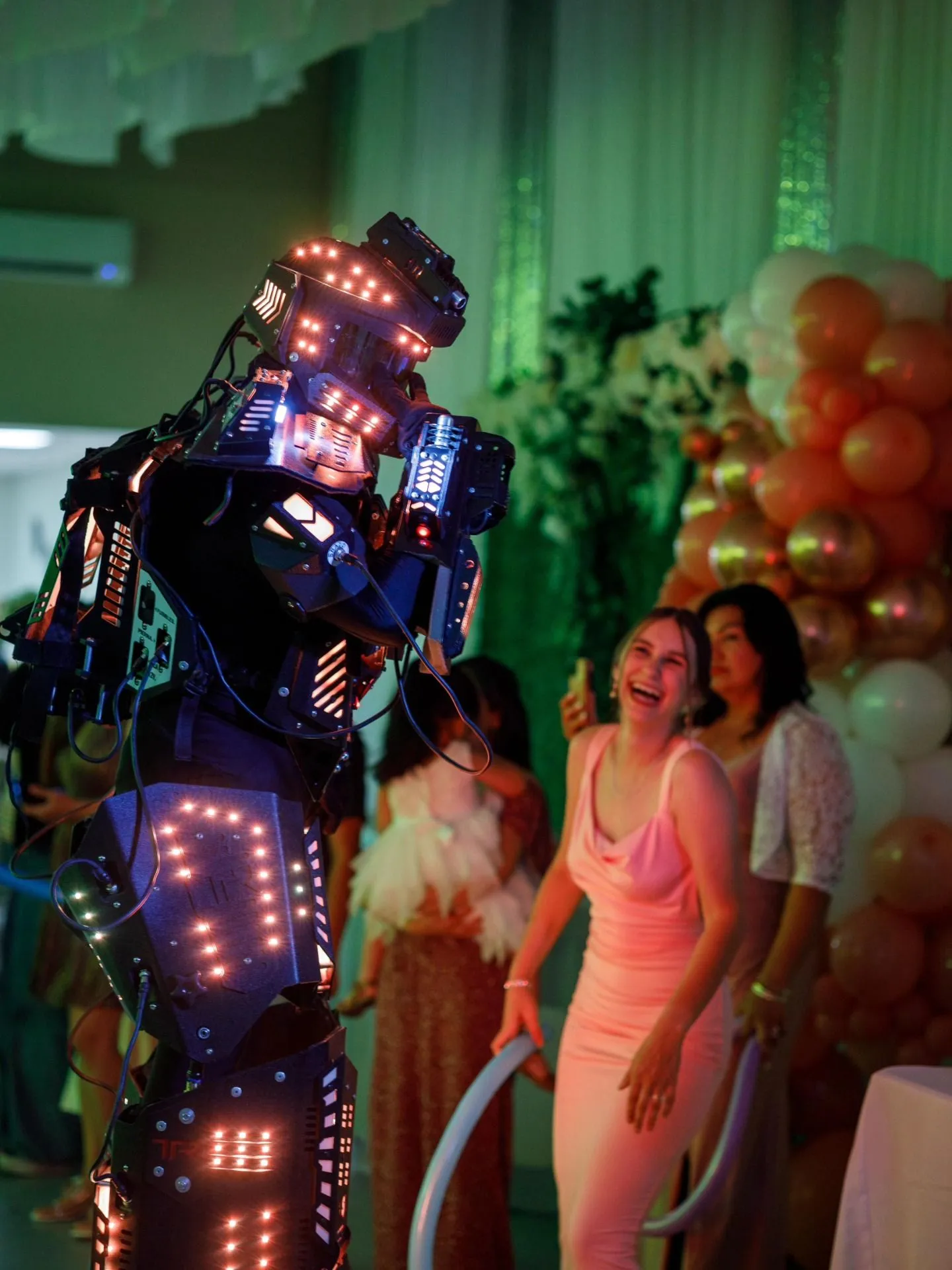 An LED robot making a guest laugh