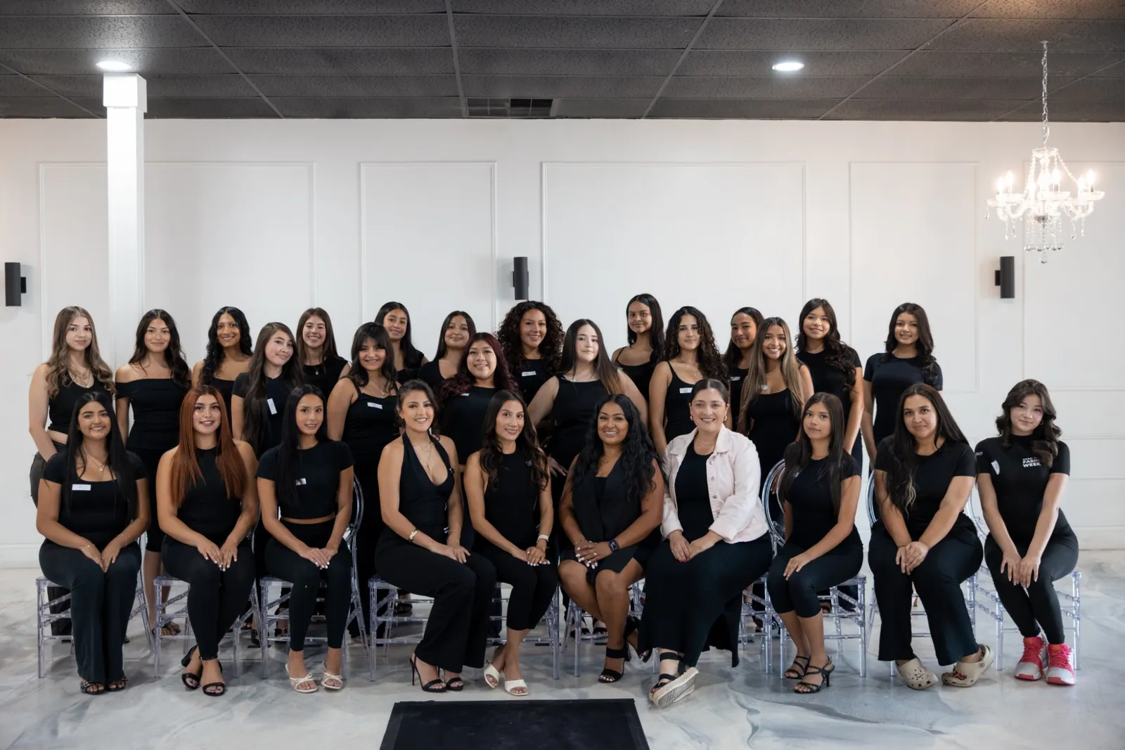 Emily Vitela with the Once Upon a Princess finalists, all dressed in black