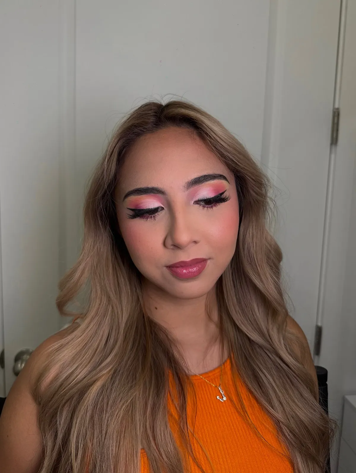 A pink and orange sunset eye look
